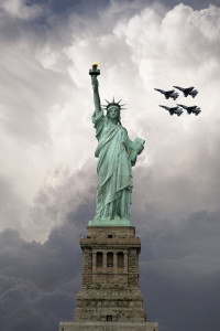 The front view of the statue of liberty with fighter planes racing across the sky behind this great New York City Monument